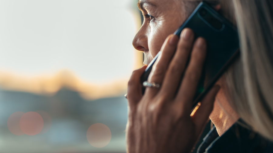 woman holding phone to ear