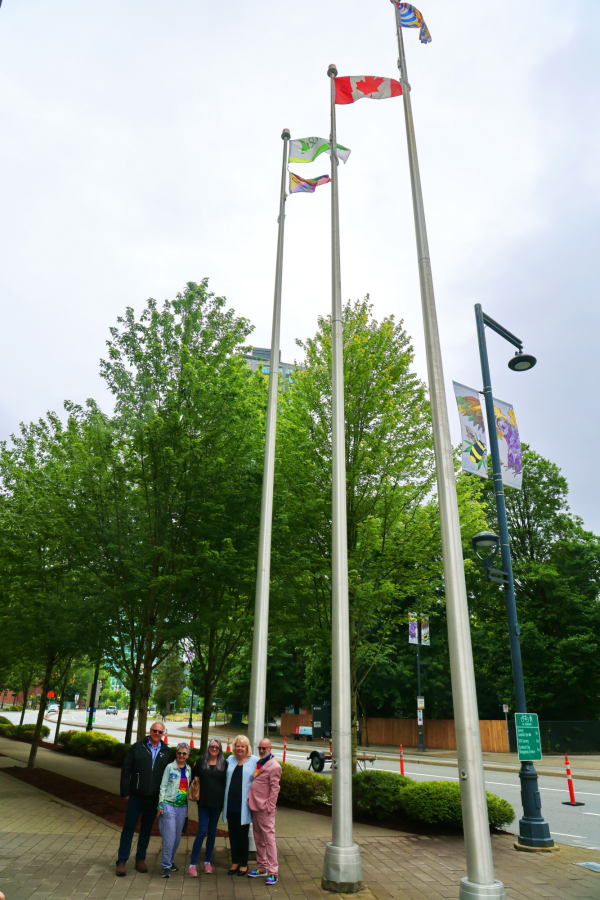 From left, Surrey Councillor Mike Bose, Penny Priddy, Jen Marchbank, Surrey Mayor Brenda Locke and Surrey Pride Society President Martin Rooney celebrate the raising of the Pride Flag in Surrey