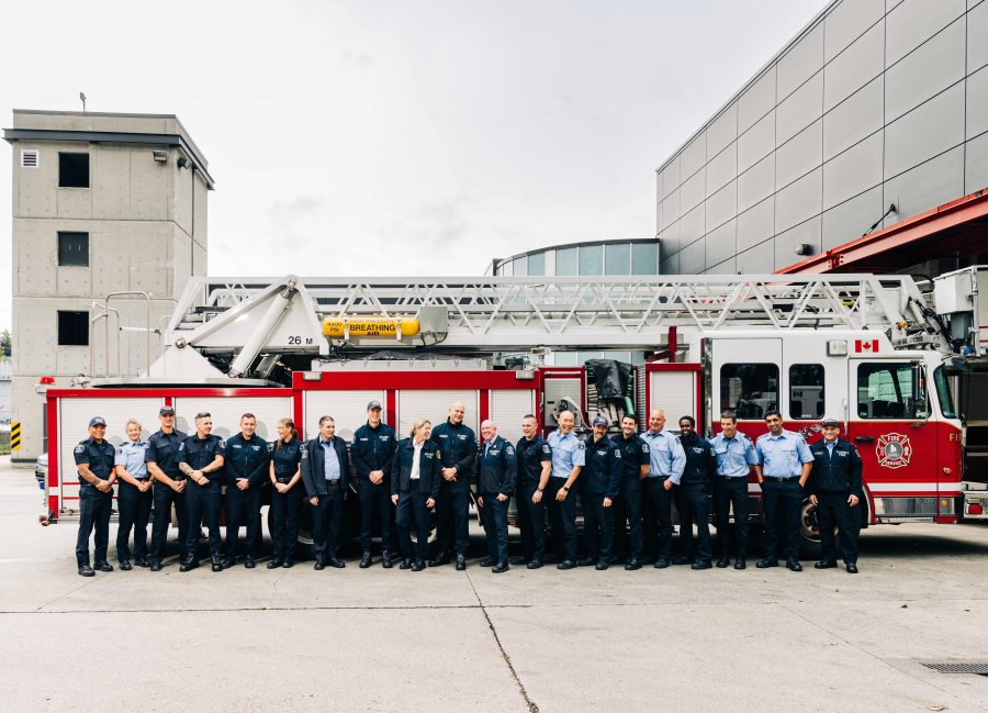 fire staff in front of truck at firehall 1